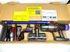 Dyson vacuum cleaner with attachments on a cardboard box