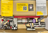 Dyson vacuum cleaner with attachments on a cardboard box